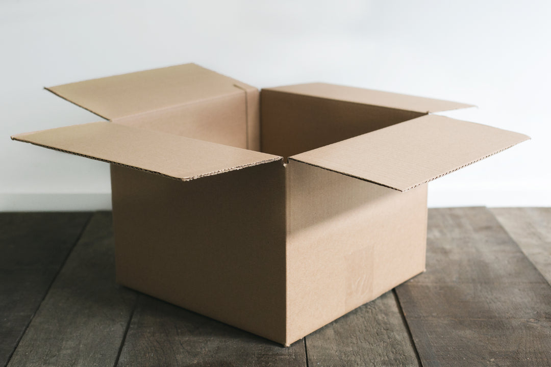 Shipping box on wooden floor 