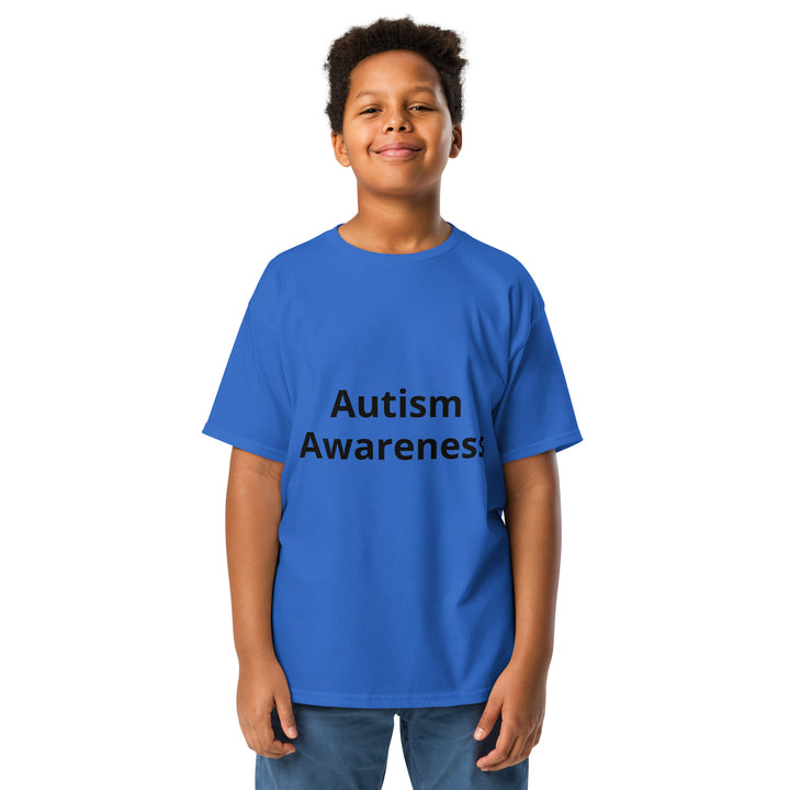 Kid wearing royal blue colored t-shirt with black wording “Autism Awareness”