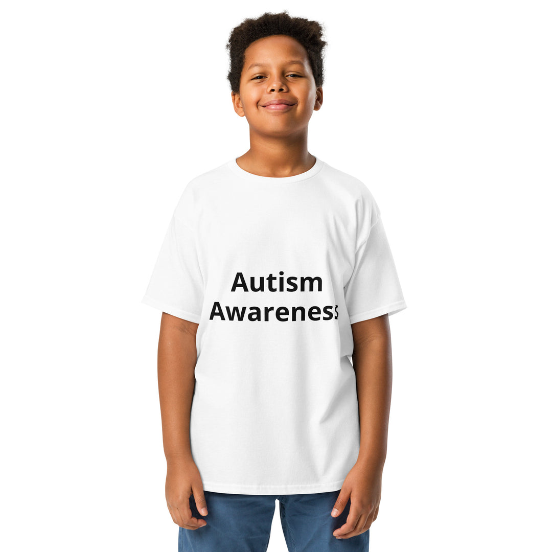 Kid wearing white colored t-shirt with black wording “Autism Awareness”